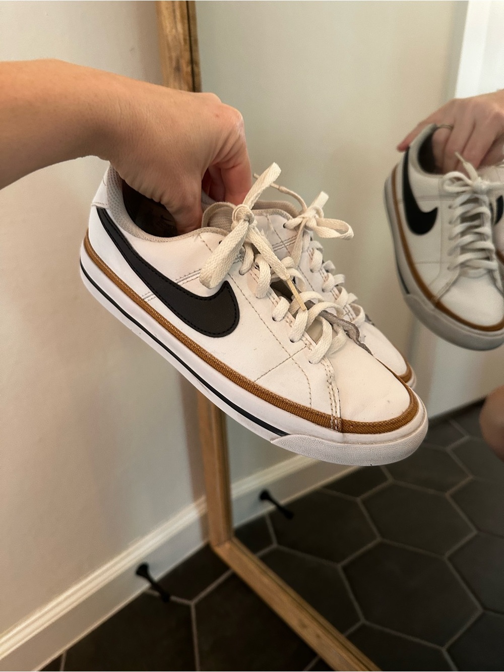 Nike White Low-Top Sneakers with Black Swoosh and Tan Trim